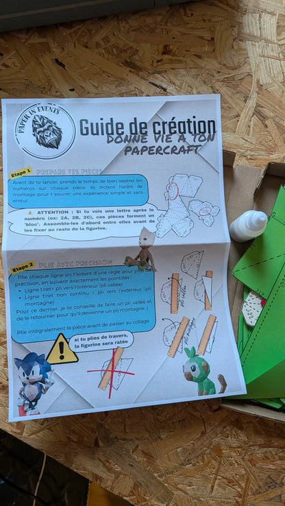 Guide de création illustré pour monter son papercraft facilement avec étapes de pliage.