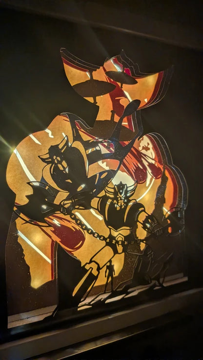 Lightbox Goldorak avec effet de profondeur en papier découpé, scène de combat mythique.
