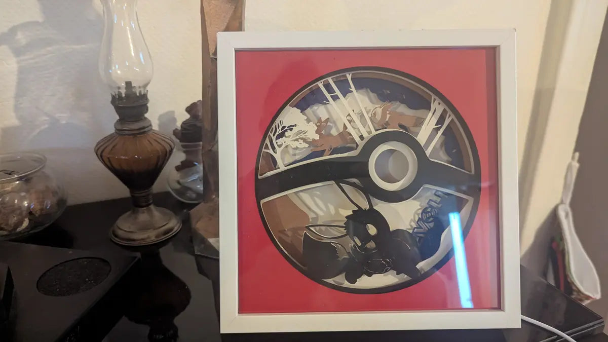 Lightbox Pokéball avec Évoli, décoration Pokémon en papier découpé