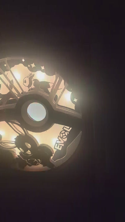 Présentation du cadre lightbox Évoli en papier multicouche, style papercraft