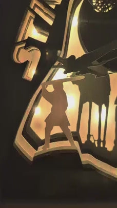 Vidéo de la lightbox Star Wars allumée montrant l’Étoile de la Mort et les AT-AT dans une composition en papier découpé rétro-éclairée